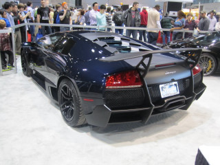 Black sports car showroom crowd - a crowd of people free wallpaper
