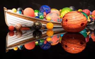 Boat balls reflection water side - a surrealist sculpture free wallpaper