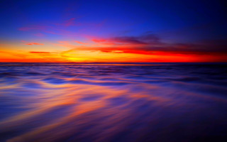 Sunset ocean wave shore red - sky in the background free wallpaper