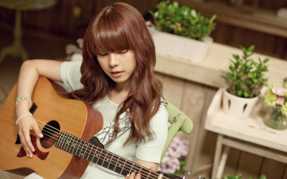 Woman red hair guitar flowers - a guitar in a room free wallpaper