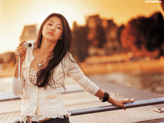Woman camera water buildings sunset - the background and a sunset free wallpaper
