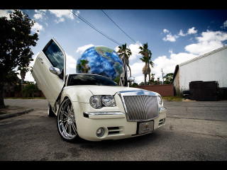 White car globe hood parked - the street in front free wallpaper