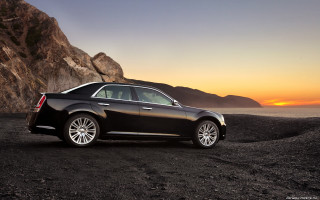 Black car rocky beach sunset - a rocky beach free wallpaper