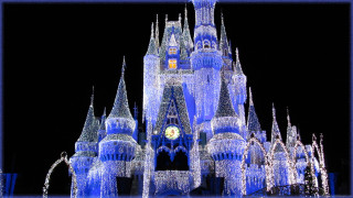 Castle clock night lights snow - a blue frame free wallpaper