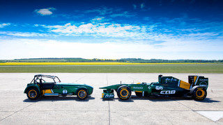 Green race cars parked tarmac - eiq free wallpaper