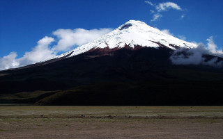 Snowcapped mountain field blue sky - a large mountain free wallpaper