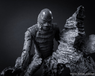 Creature statue holding rock large - ed binkley free wallpaper