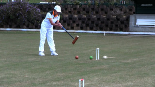 Person hitting ball bat tee - short depth of field free wallpaper