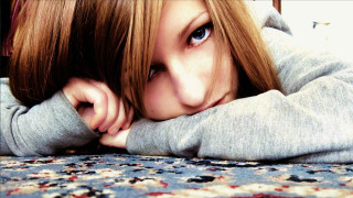 Woman laying bed hands head 2 - photorealistic portrait free wallpaper