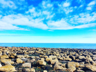 Rocky beach blue sky clouds 2 - a body of water free wallpaper for desktop