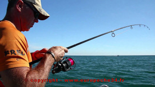 Man fishing boat rod reel - a boat in the background free wallpaper