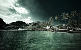 Boat docked tropical island palm - a tropical island free wallpaper