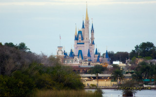 Castle towers trees water scenery - free ship wallpaper