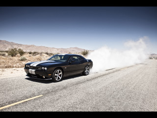 Black car driving dusty road - a matte painting free wallpaper
