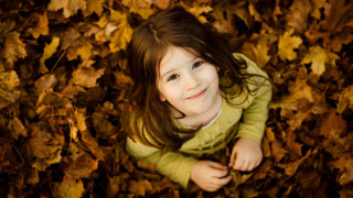 Little girl leaves smiling autumn 2 - a little girl free wallpaper