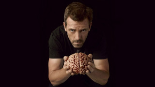 Man holding brain black background 3 - erlund hudson free wallpaper