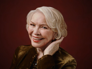 Blonde woman smiling brown jacket - anne dunn free wallpaper