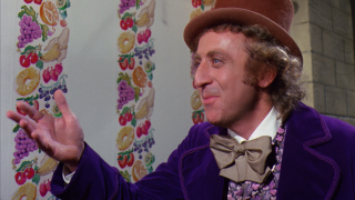 Man purple suit hat hands - his hands out in front free wallpaper
