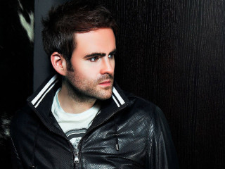 Man leather jacket leaning wall - dave kendall free wallpaper