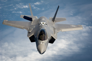 Fighter jet cloudy sky propeller 8 - a cloudy blue sky free wallpaper