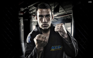 Man black shirt posing fists - his fist free wallpaper