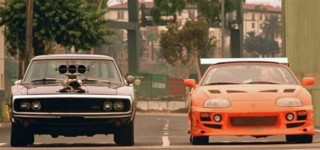 Two cars driving street building - the front of the car free wallpaper