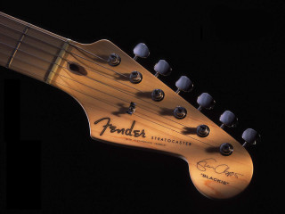 Guitar neck closeup black background - a close up of a guitar neck free wallpaper