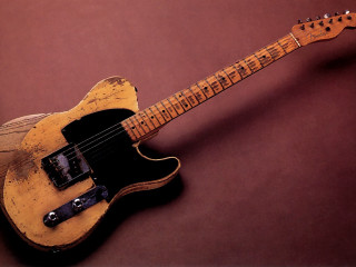 Yellow guitar black neck brown - a brown background free wallpaper