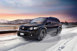 Black suv snowy road sunset - the background and a body of water free wallpaper