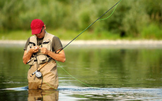 Man red hat fishing water - river free wallpaper