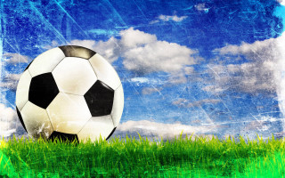 Soccer ball green field blue 2 - a soccer ball free wallpaper