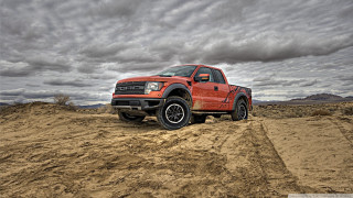Red truck desert dirt road - cloud above free wallpaper