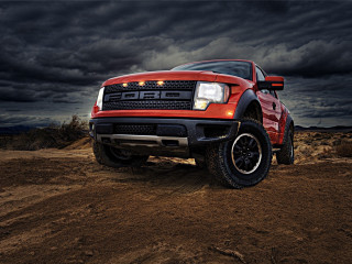 Red truck dirt field cloudy 2 - a black car in the foreground free wallpaper