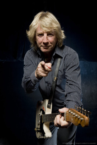 Blonde man guitar black background - a guitar free wallpaper