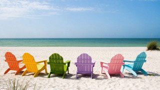 Colorful chairs sandy beach ocean 4 - a green grass free wallpaper