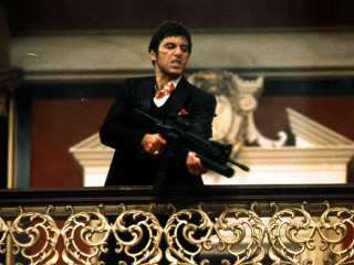 Man holding gun balcony railing - movie scene free wallpaper