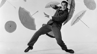 Man holding multiple umbrellas beach - alberto vargas free wallpaper