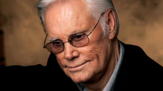 Man glasses black jacket smiling - free portrait wallpaper