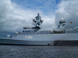 Battleship floating water cloudy sky 5 - the water below free wallpaper