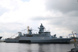 Battleship dock boat cloudy sky - a large battleship free wallpaper