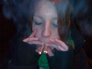 Woman smoking cigarette dark room - carey morris free wallpaper