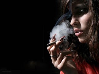 Woman smoking cigarette dark smoke - her mouth and a cigarette free wallpaper