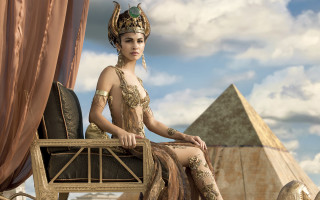 Woman costume chair pyramid clouds - the sky behind her free wallpaper