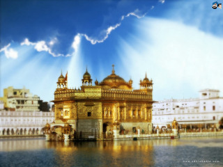 Golden building blue sky clouds - radiant free wallpaper