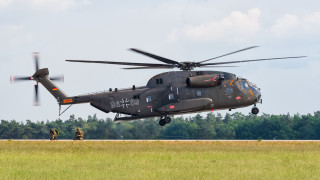 Helicopter flying low field grass 2 - carl eugen keel free wallpaper