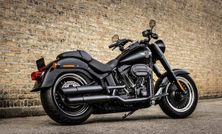 Black motorcycle brick wall parking 2 - a brick wall free wallpaper