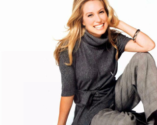 Woman sitting gray shirt gray - promotional image free wallpaper