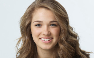 Woman long hair smiling photorealistic - a white background behind her free wallpaper