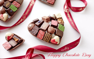 Heart shaped box of chocolates - a red ribbon free wallpaper