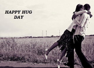 Hugging couple grass field sky - a photo free wallpaper
